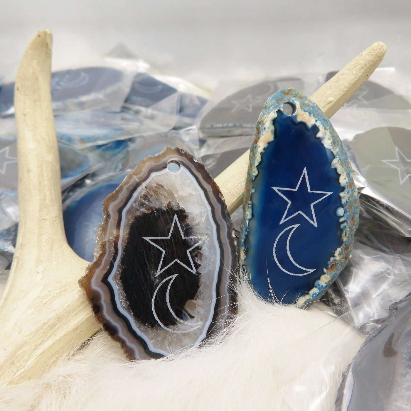 Black and Blue agate slices being displayed next to each other. 