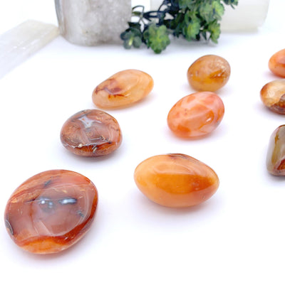 close up of carnelian stones on a white background