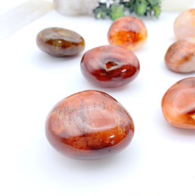 clsoe up of carnelian stones on a white background