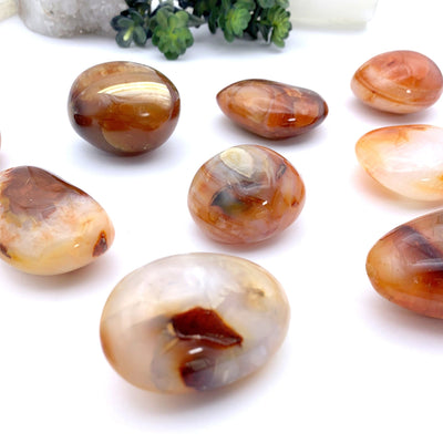 close up of carnelian stones on a white background