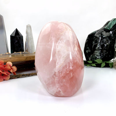 Different angle rose quartz sitting on white background