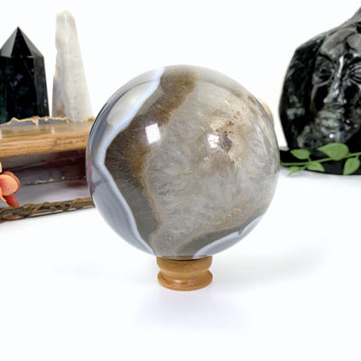 Natural Agate Druzy Sphere on a wooden stand - gray , white and brown