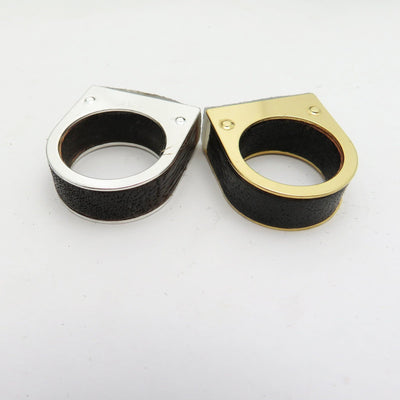 Backside of two rings.  Both have wood inserts in the band and one is silver plated the other gold plated.