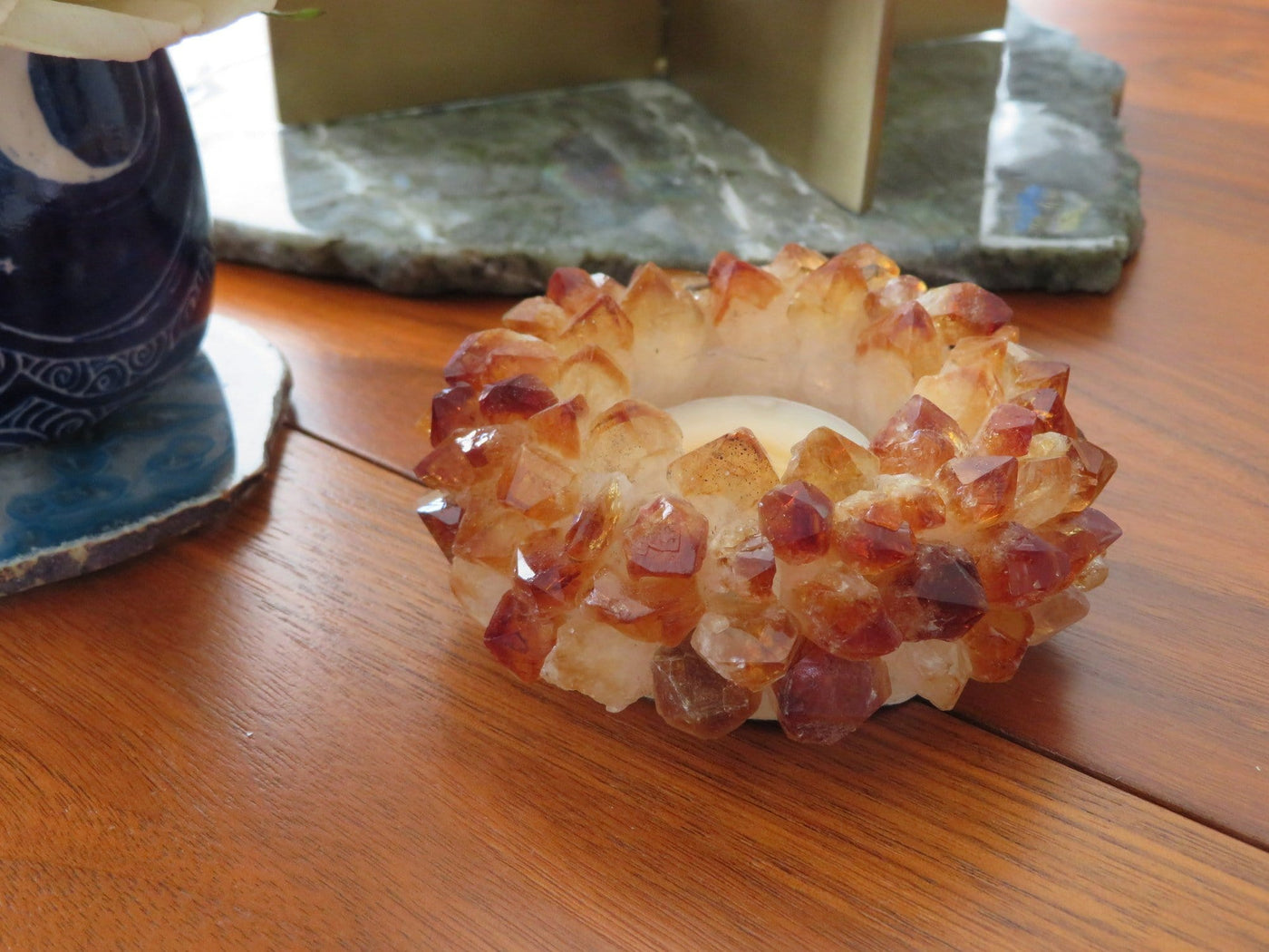 Citrine Point Candle Holder - close up and on a table