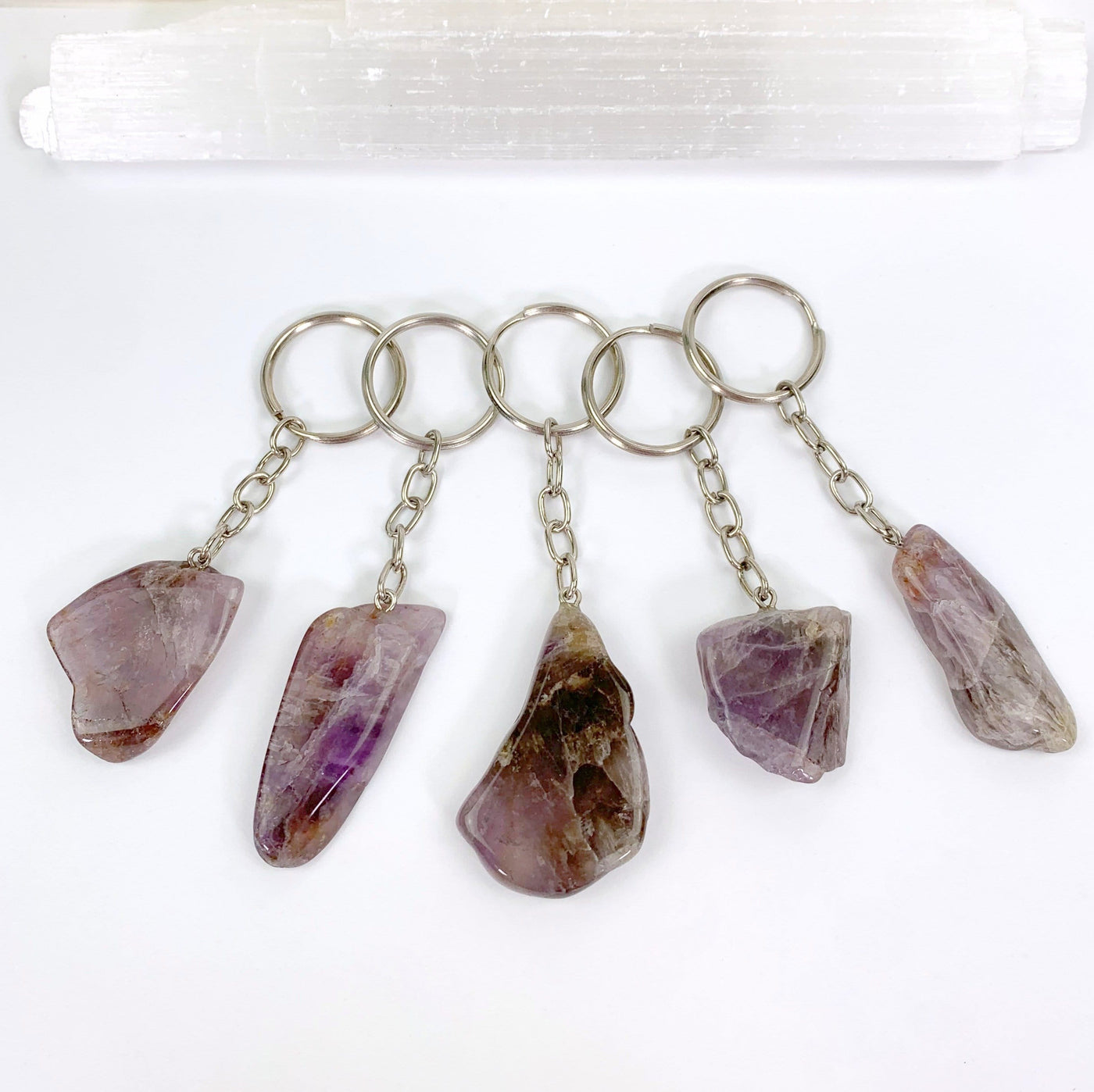 five seven mineral amethyst slab keychains on display for possible variations
