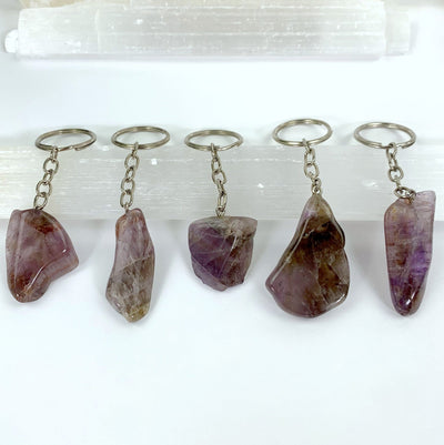 five seven mineral amethyst slab keychains on display for possible variations