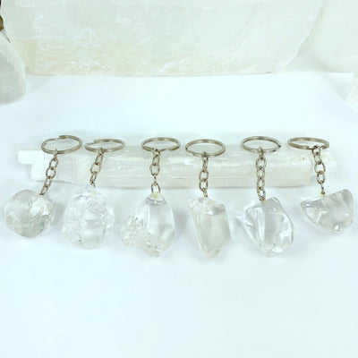 6 crystal quartz keychains displayed to show various sizes and shapes