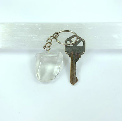 keychain displayed next to key for size reference