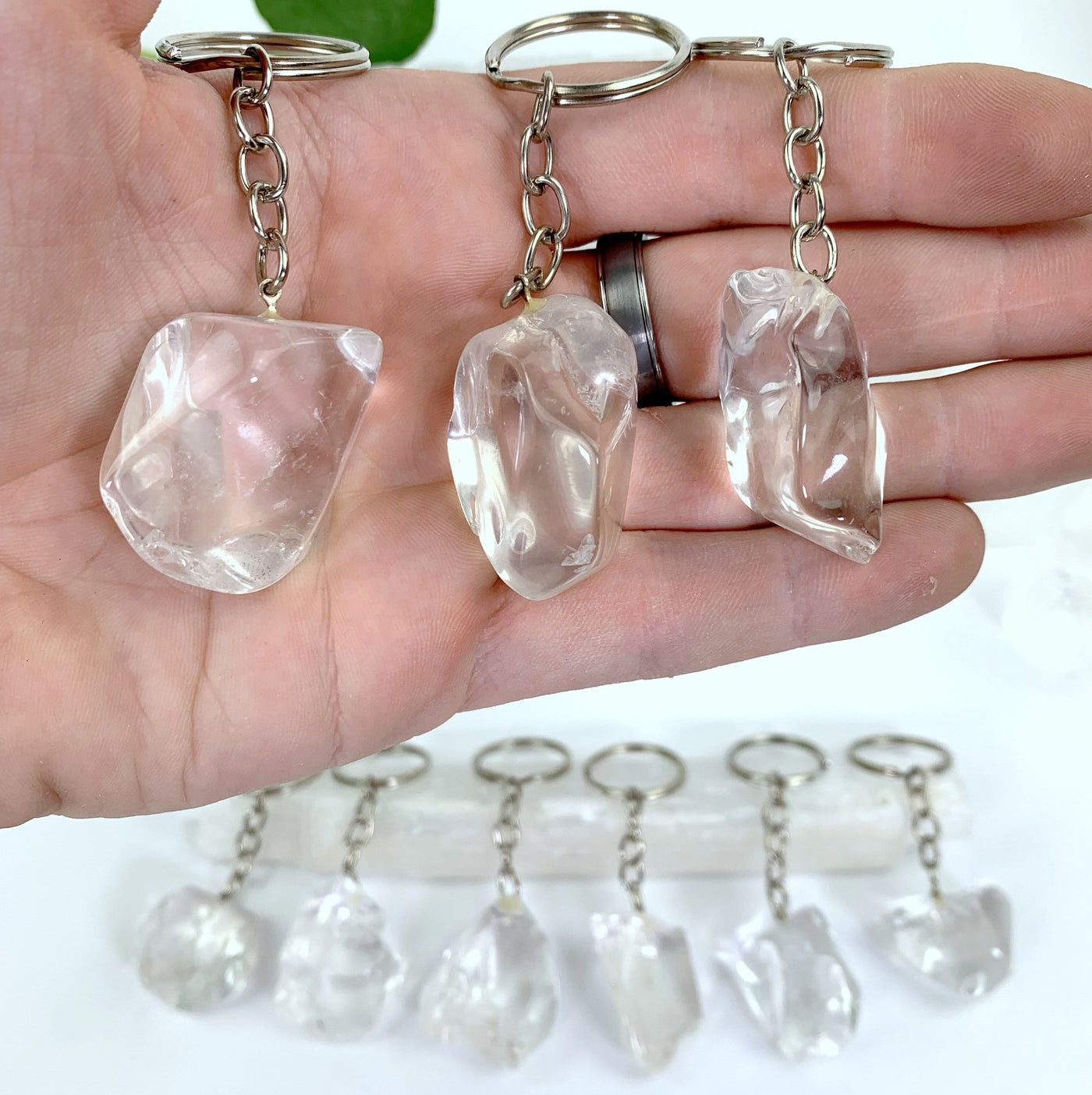 Crystal Ice Cube Keychains with silver links and hoop ring in hand for size reference