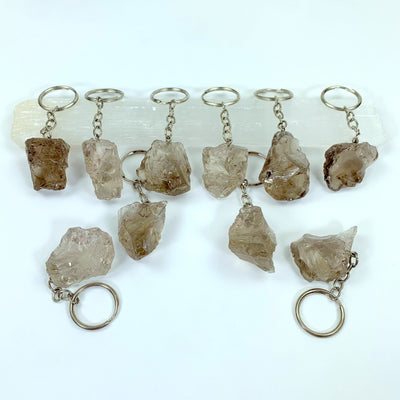 Natural Smoky Quartz Keychains - several on a table