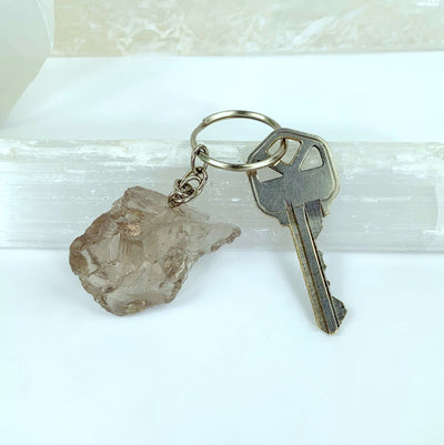 Natural Smoky Quartz Keychains - one with a key on it