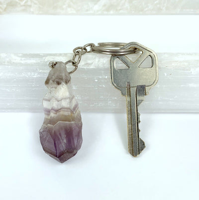Natural Chevron Amethyst Keychains with a key on it