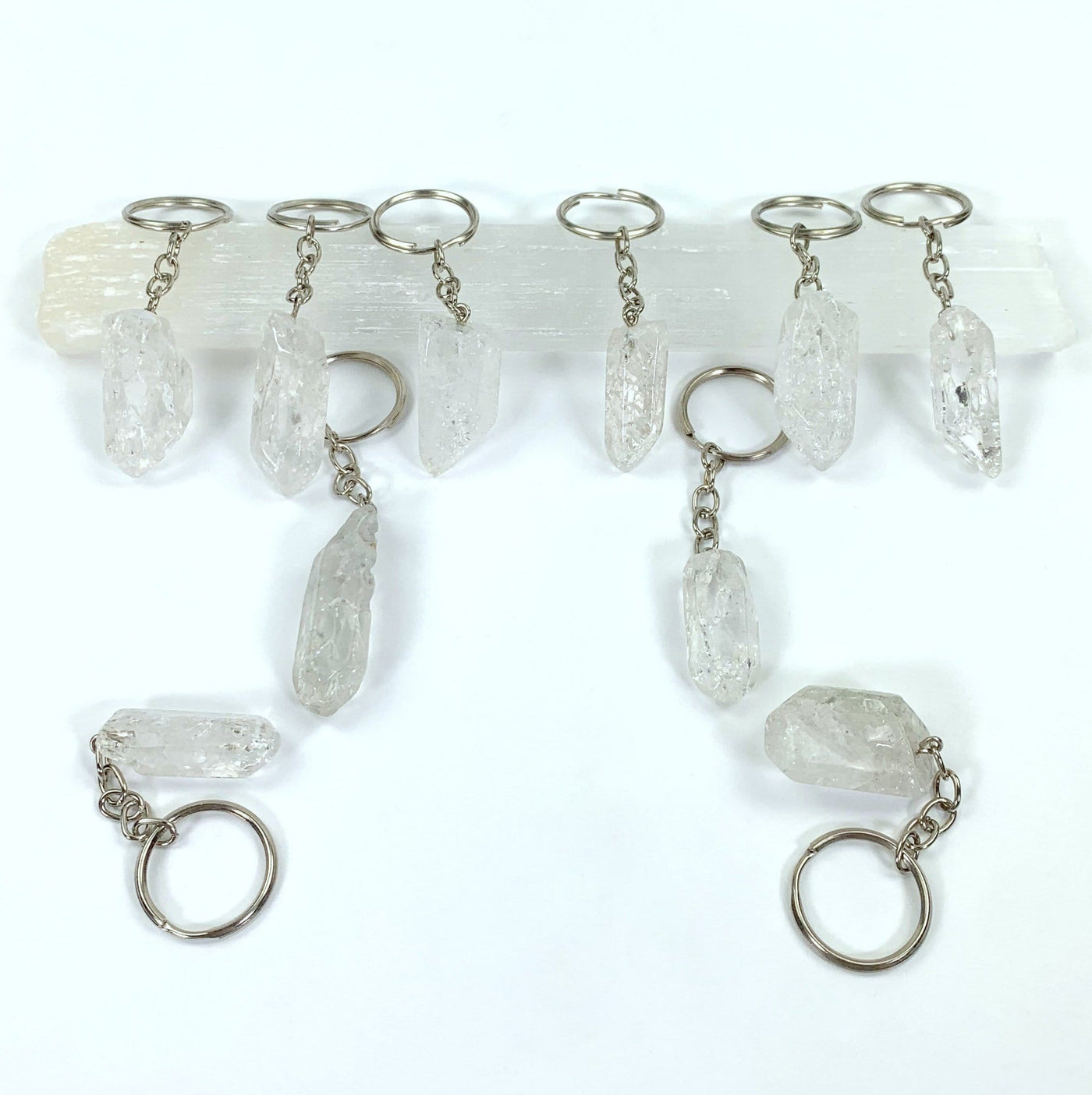 Crackle Quartz Keychains laid out to see various sizes and shapes
