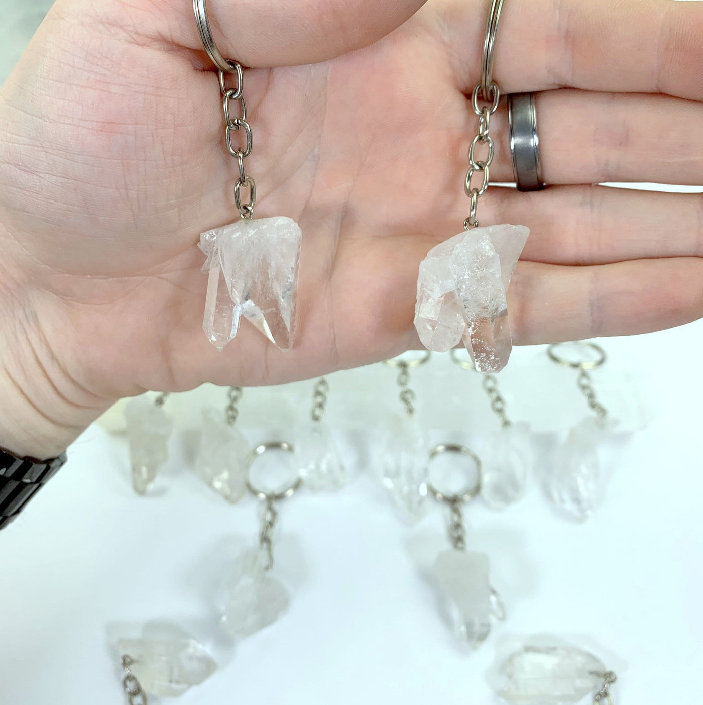 2 Twin Crystal Points Keychains in hand for size