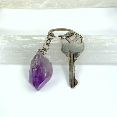 amethyst tumbled keychain with a key attached