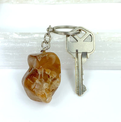 yellow quartz keychain with a key on it