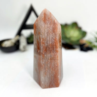 different angle of the hematite quartz polished tower point show with a white background