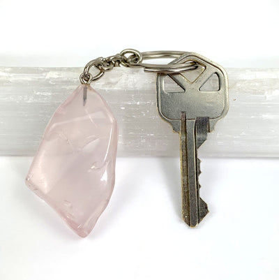 Polished Rose Quartz Keychain attached to a key