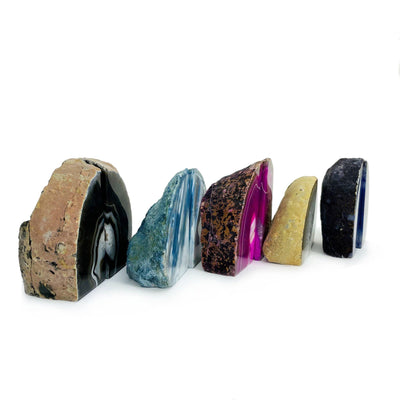 Many mini Agate Geode Bookends shown at an angle with a white background, geodes are displaying the thickness variation.
