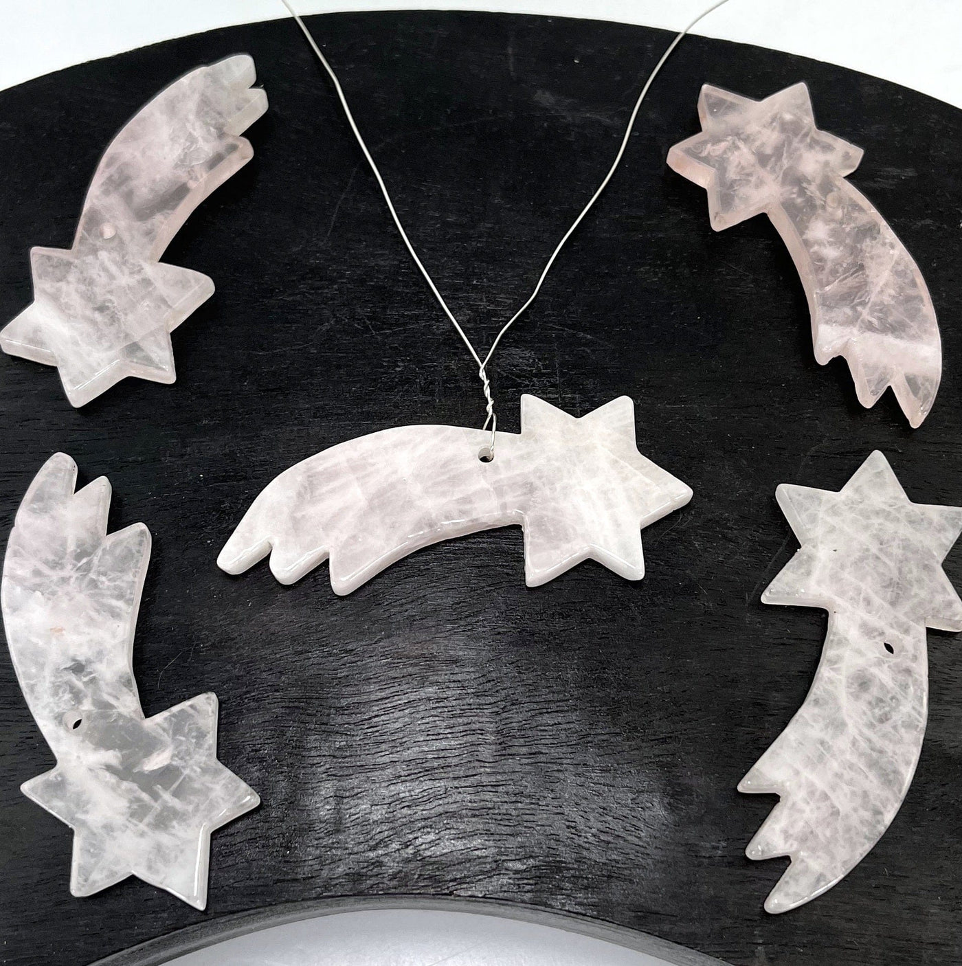 multiple shooting star top drilled pendants with center pendant shown as a wired necklace