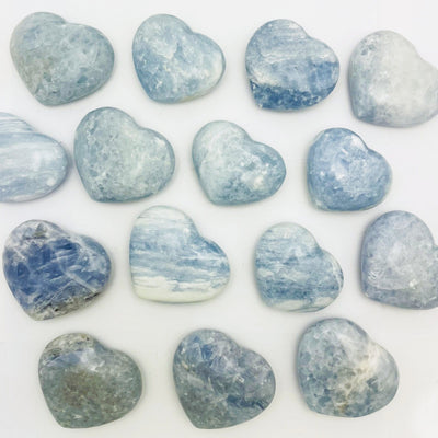 Blue Calcite Hearts on a white table