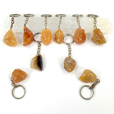 carnelian tumbled keychains displayed to show various characteristics