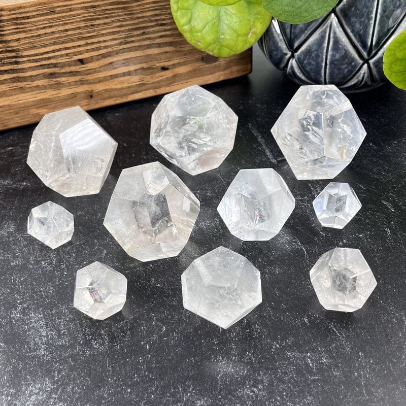 multiple crystal quartz dodecahedron shaped stones displaying the different sizes 