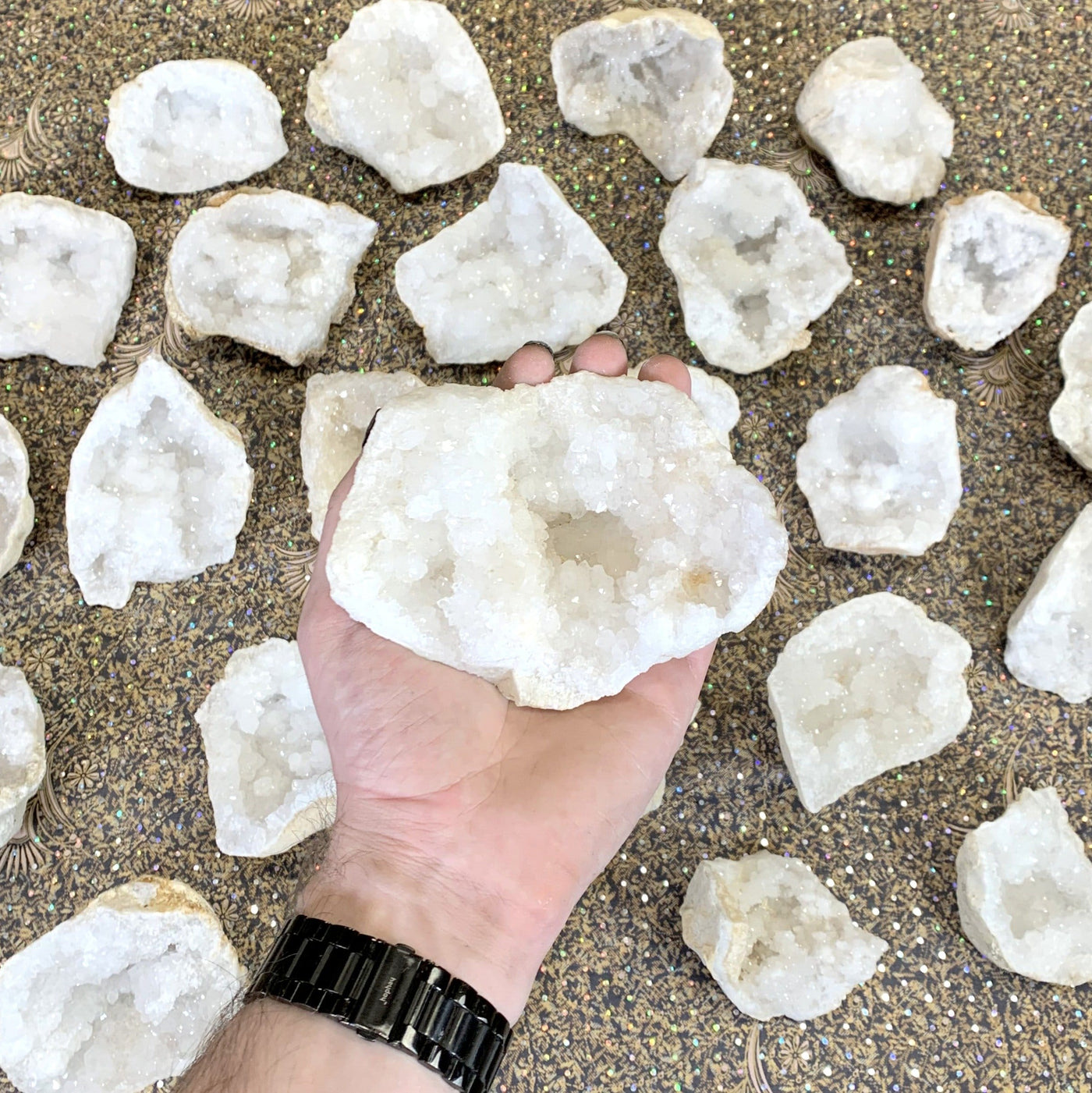 small White Quartz Druzy Half Geode in hand for size reference