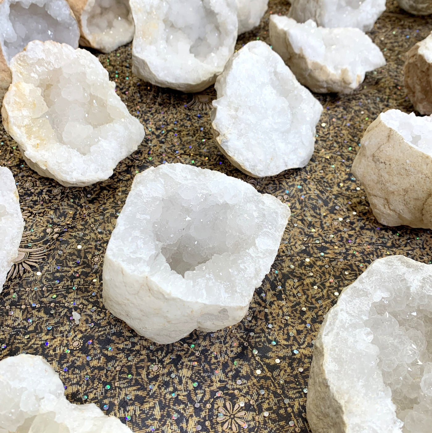 multiple half geodes displayed to show various sizes shapes crystallizations