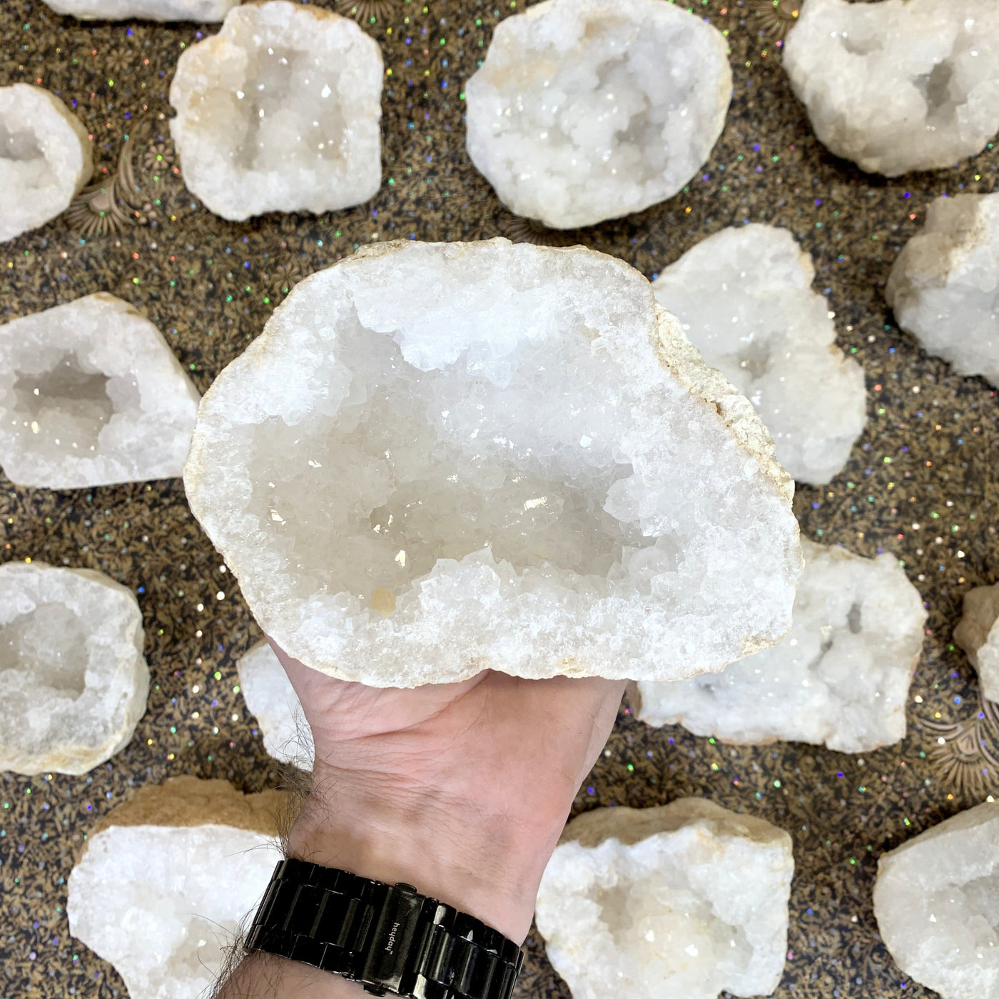 White Quartz Druzy Half Geode  in hand showing unique formation from each geode