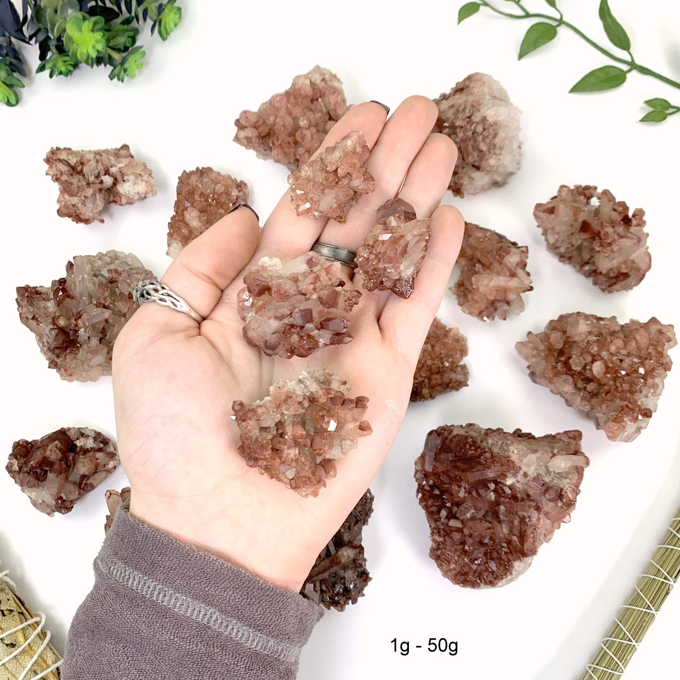 1 gram to 5 gram lithium quartz clusters 4 pieces fit in the palm of a man's hand