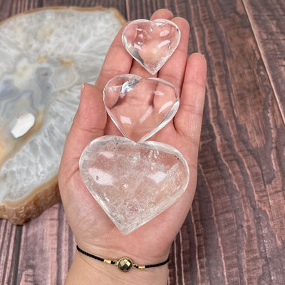 hearts in hand showing different sizes 