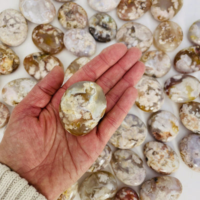 Flower Agate Polished Palm Stone on hand.