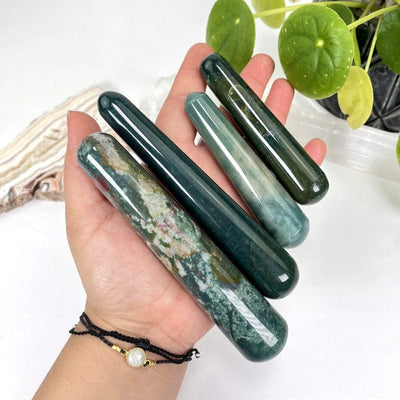 multiple bloodstone massage wands in hand for size refence 