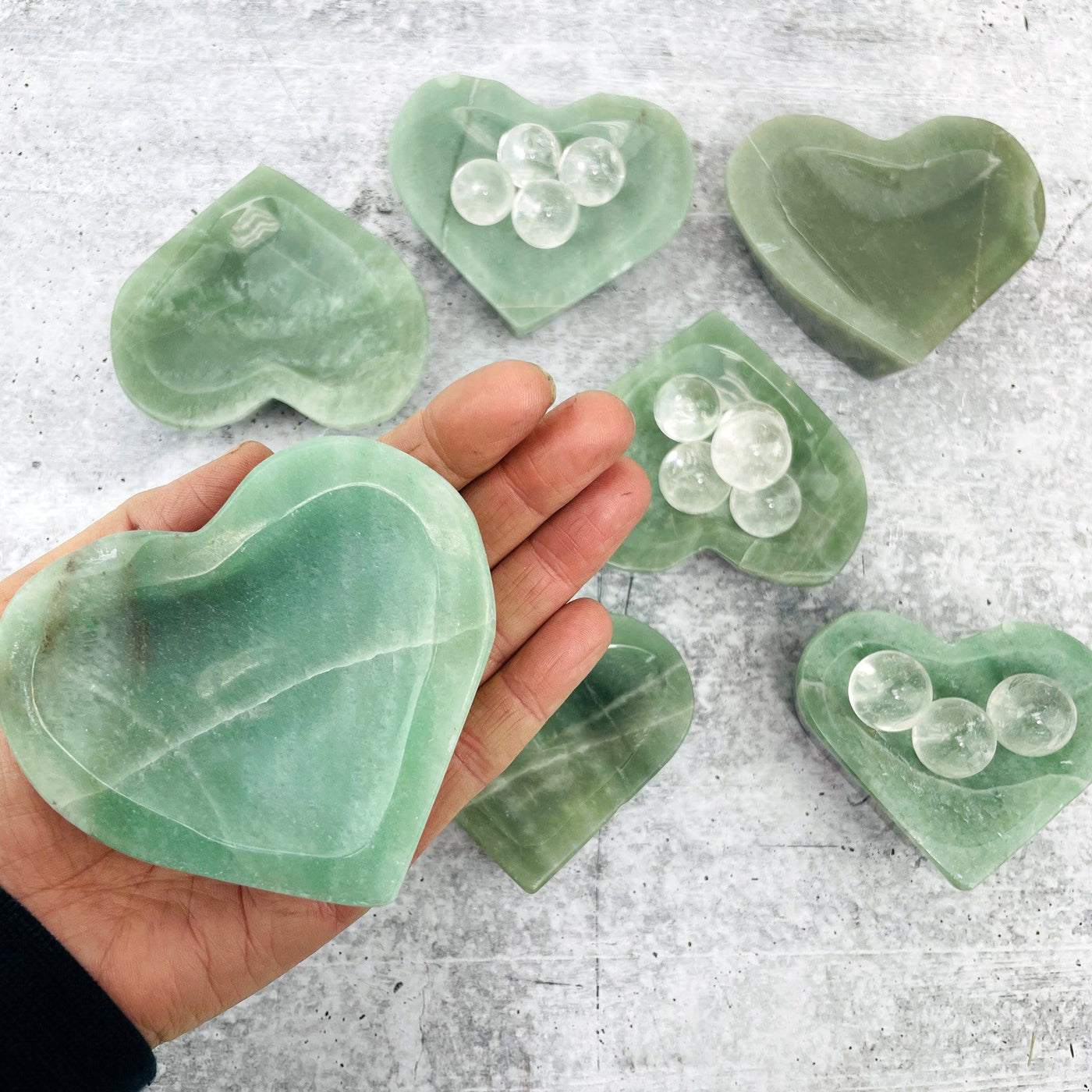 Polished Green Aventurine Stone Heart Dish in hand for size reference