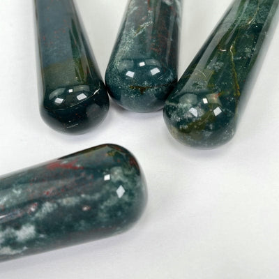 close up of the round polished end of the blood stone massage wands 