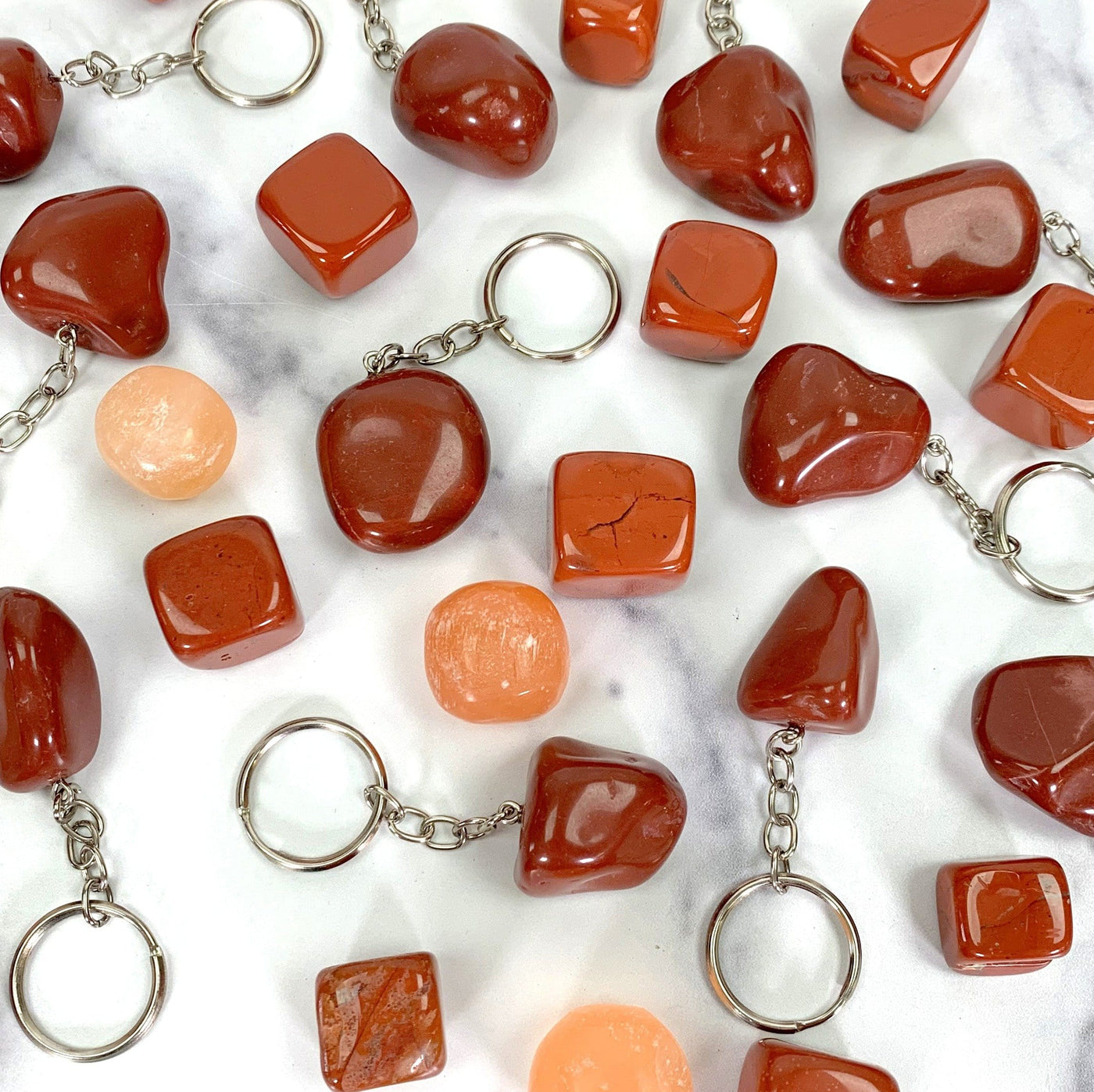 multiple Tumbled Red Jasper Keychains showing various hues shapes textures