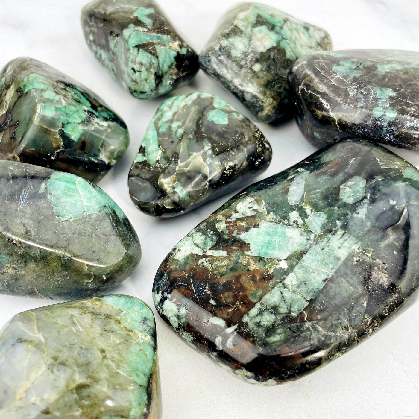 Emerald Freeform Tumble Polished Stone showing them more closely 
