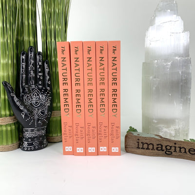 Multiple books are being displayed next to each other as a Décor sample.  