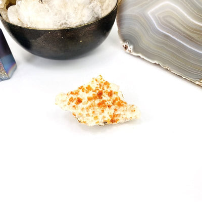 front face of natural vanadinite cluster on white background