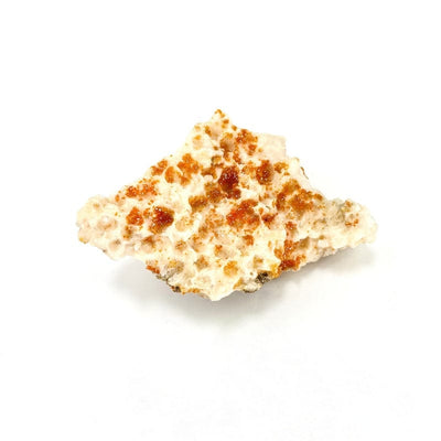 close up front view of natural vanadinite cluster on white background