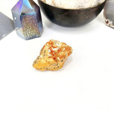 front face of natural vanadinite cluster on a white background