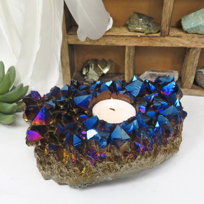 blue titanium amethyst candle holder with decorations in the background