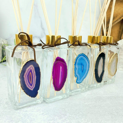 This Picture is showing all of the variety we have available for our Agate Slice Diffuser Bottles, from a side view.