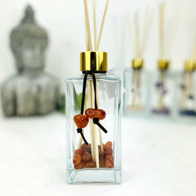 Tumbled Stone Diffuser Bottle--front view shot of glass bottle with carnelian stone on string.