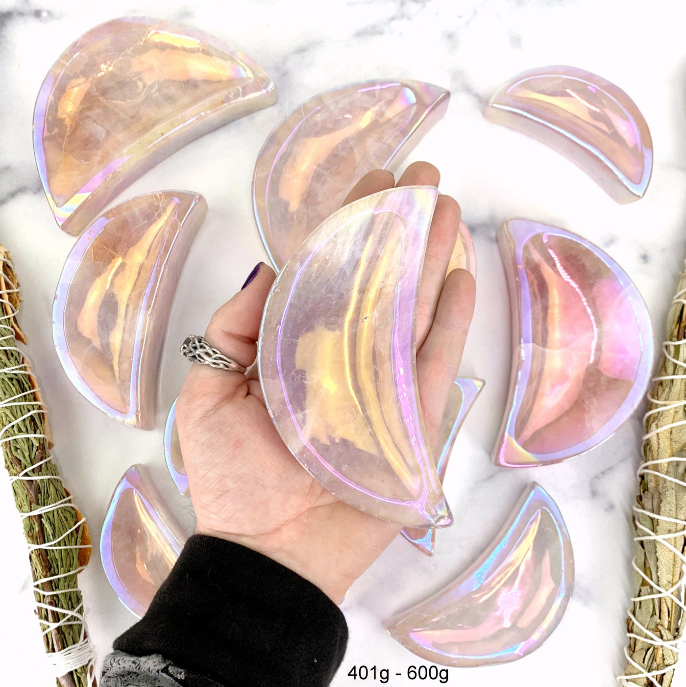 one 401gram - 600gram angel aura moon bowl in hand with marble background for size reference