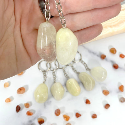 Tumbled Sulfur Keychains- on hand showing detail and size.