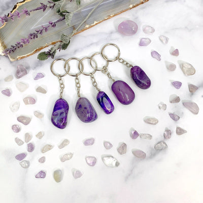  Various Purple Tumbled Dyed Agate Keychains to show different colors patterns shapes thickness and texture