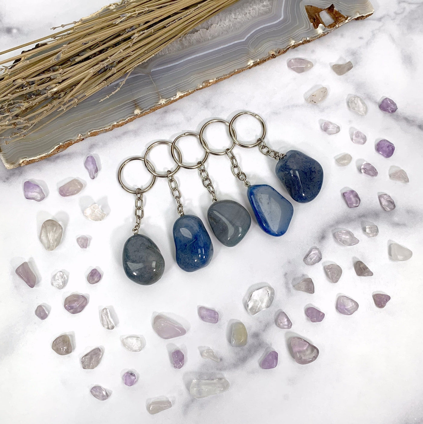  Various Blue Tumbled Dyed Agate Keychains to show different colors patterns shapes thickness and texture