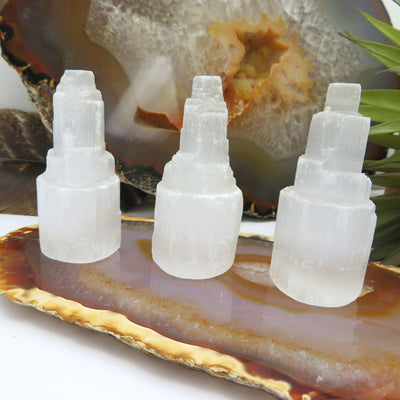 three selenite raw crystal towers on display for possible variations 
